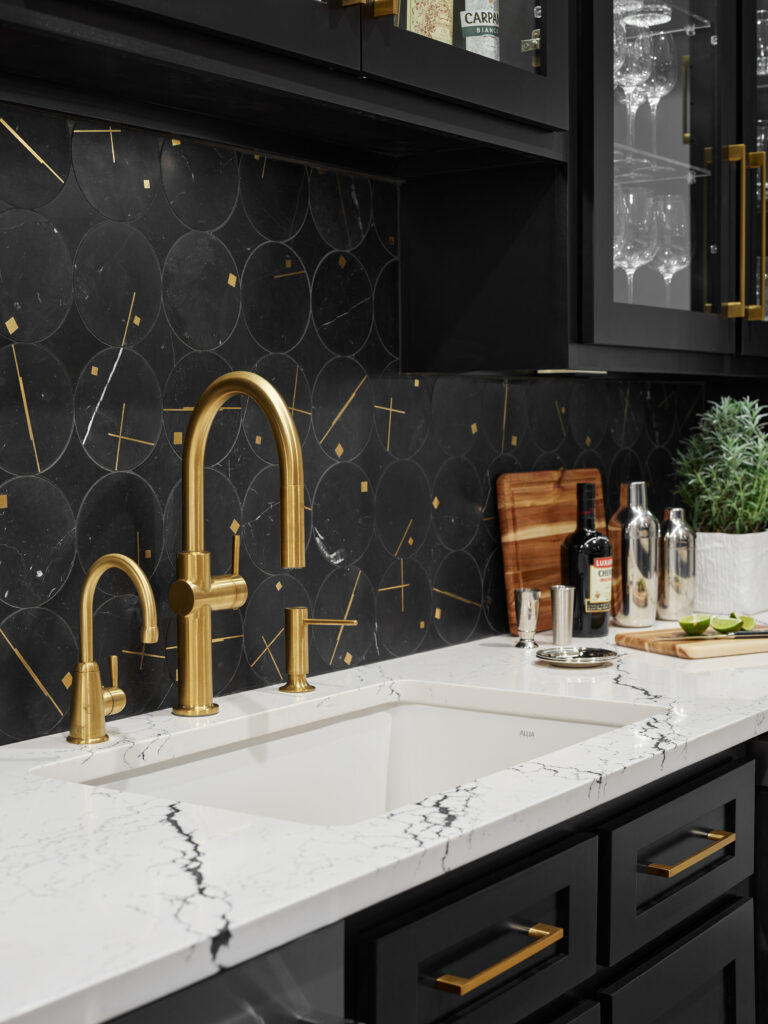 Brass faucets and accents add gorgeous style to this home bar.