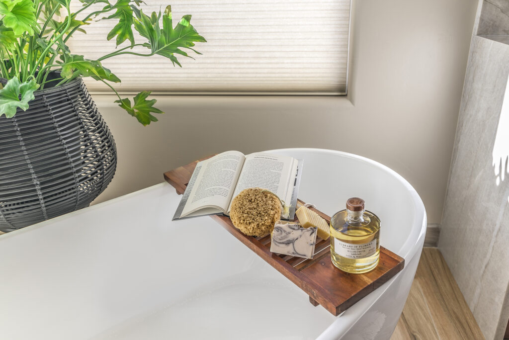 The play of textures in this bathroom vignette successfully demonstrates the power of starting with a neutral base, combining opposites, and bringing in natural materials.